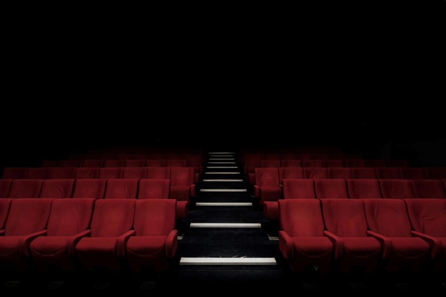 Dark lit movie theater seats