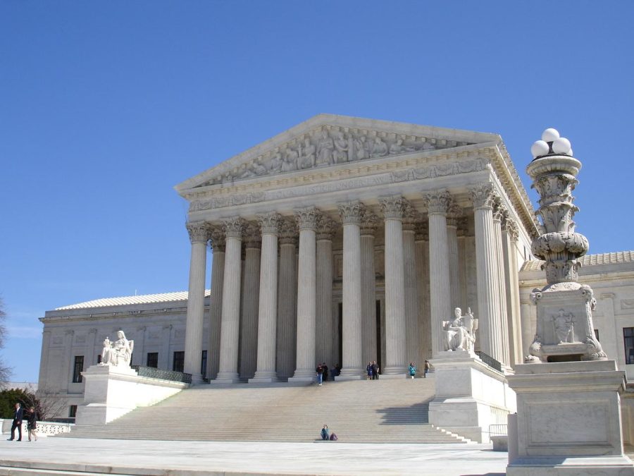 A+picture+of+the+U.S.+Supreme+Court+building+against+a+blue+sky.