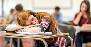 student sleeping on desk