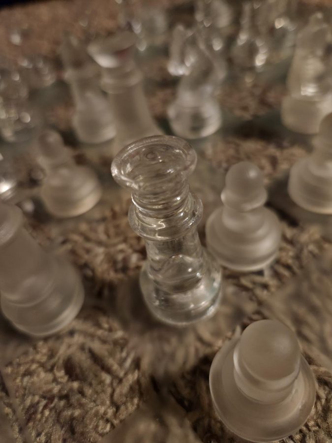 Glass chess board, queen pictured.