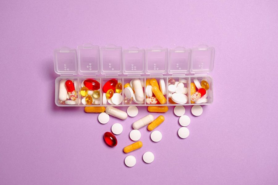 A purple background with an assortment of pills.