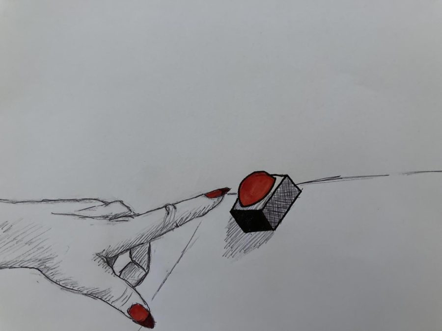 A womans hand with long red nails pushing a red button