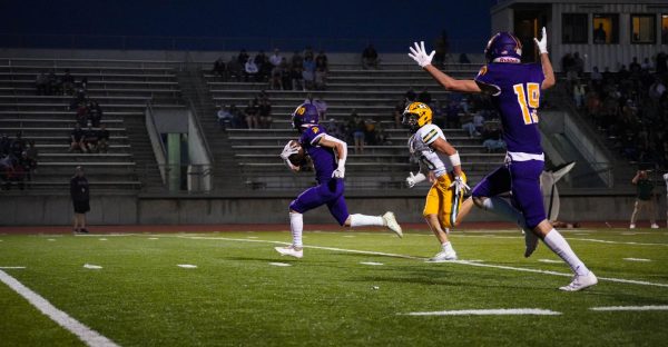 Kyler Haslam (12) sprinting down the field