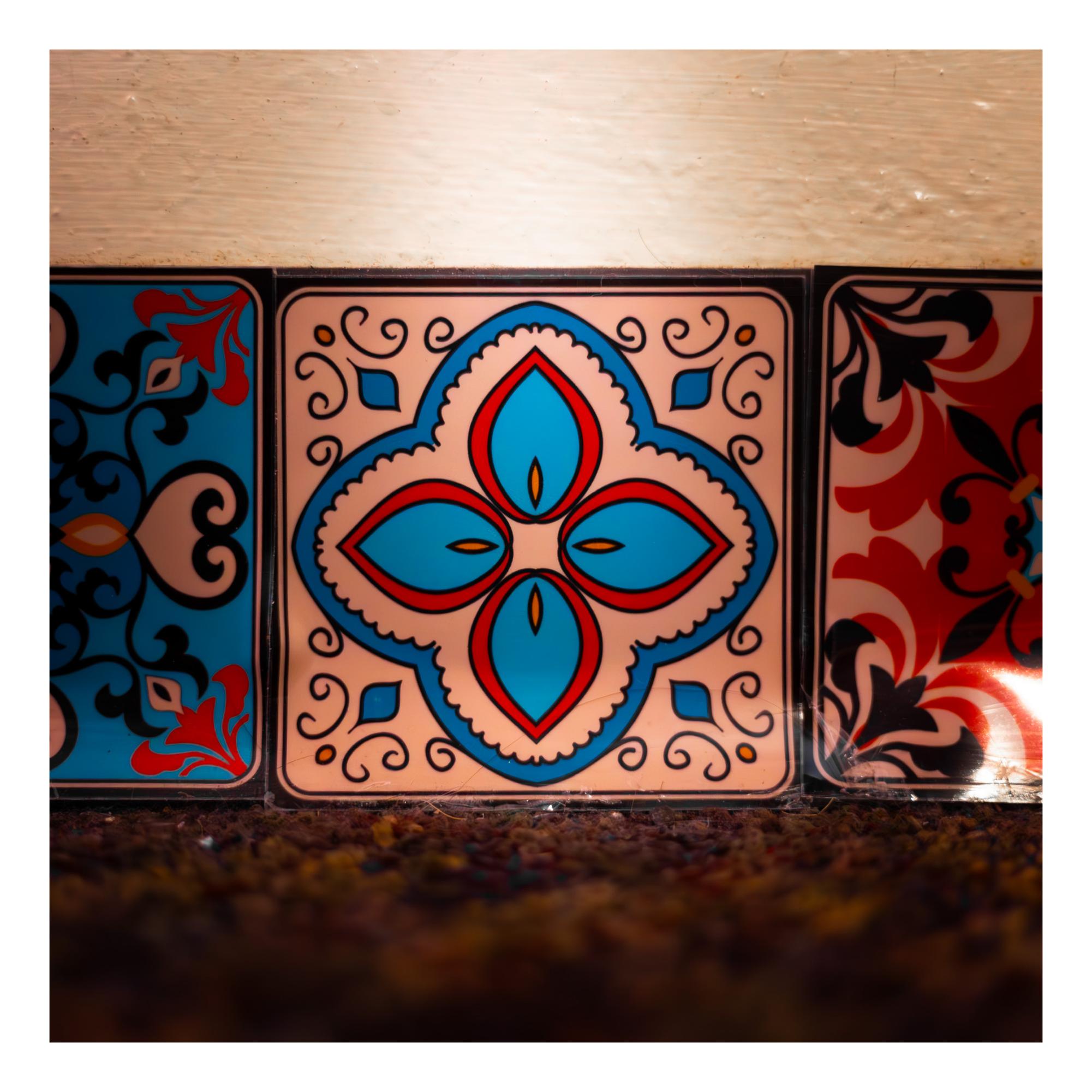 A slightly bent wall tile with a flower pattern