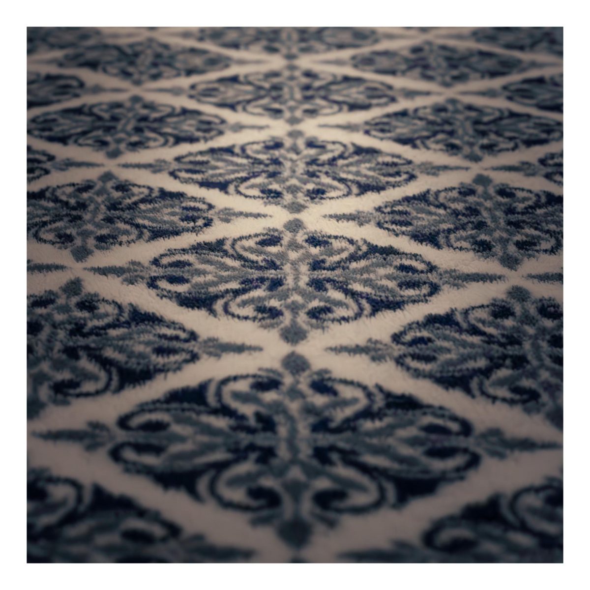 A blanket lying with a repeating pattern