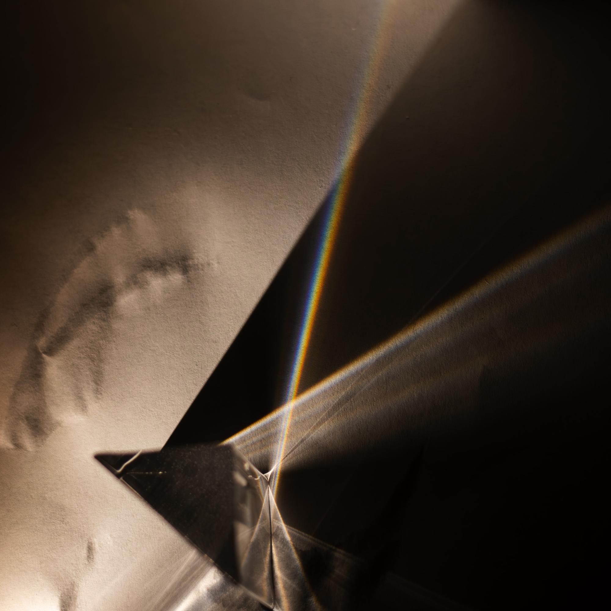 A prism refracting light into a rainbow